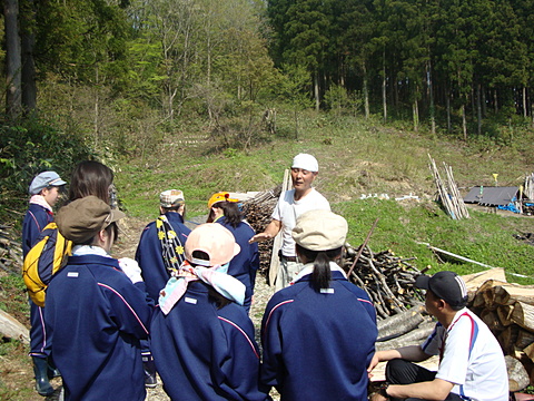 Students listening to the story of the charcoal making uncle (laugh) seriously